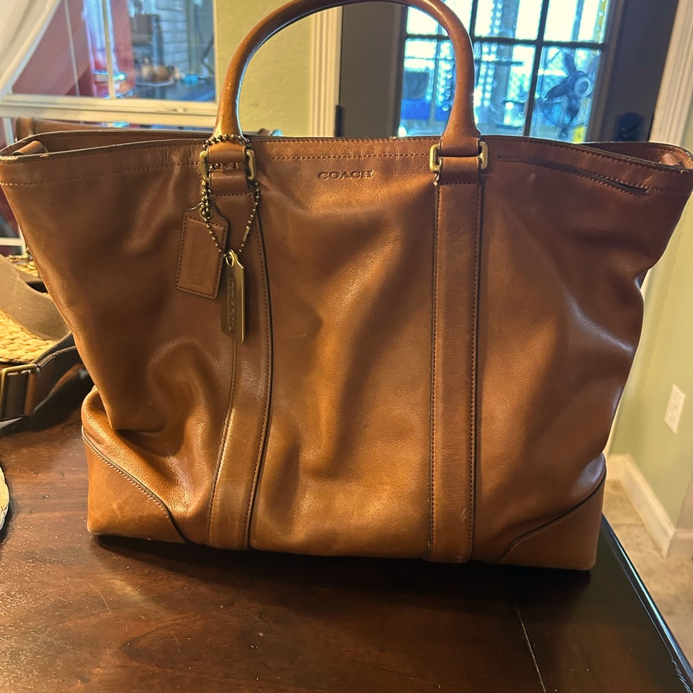 Coach, leather overnight bag. 13.5x18x15 in.(HxWxD).